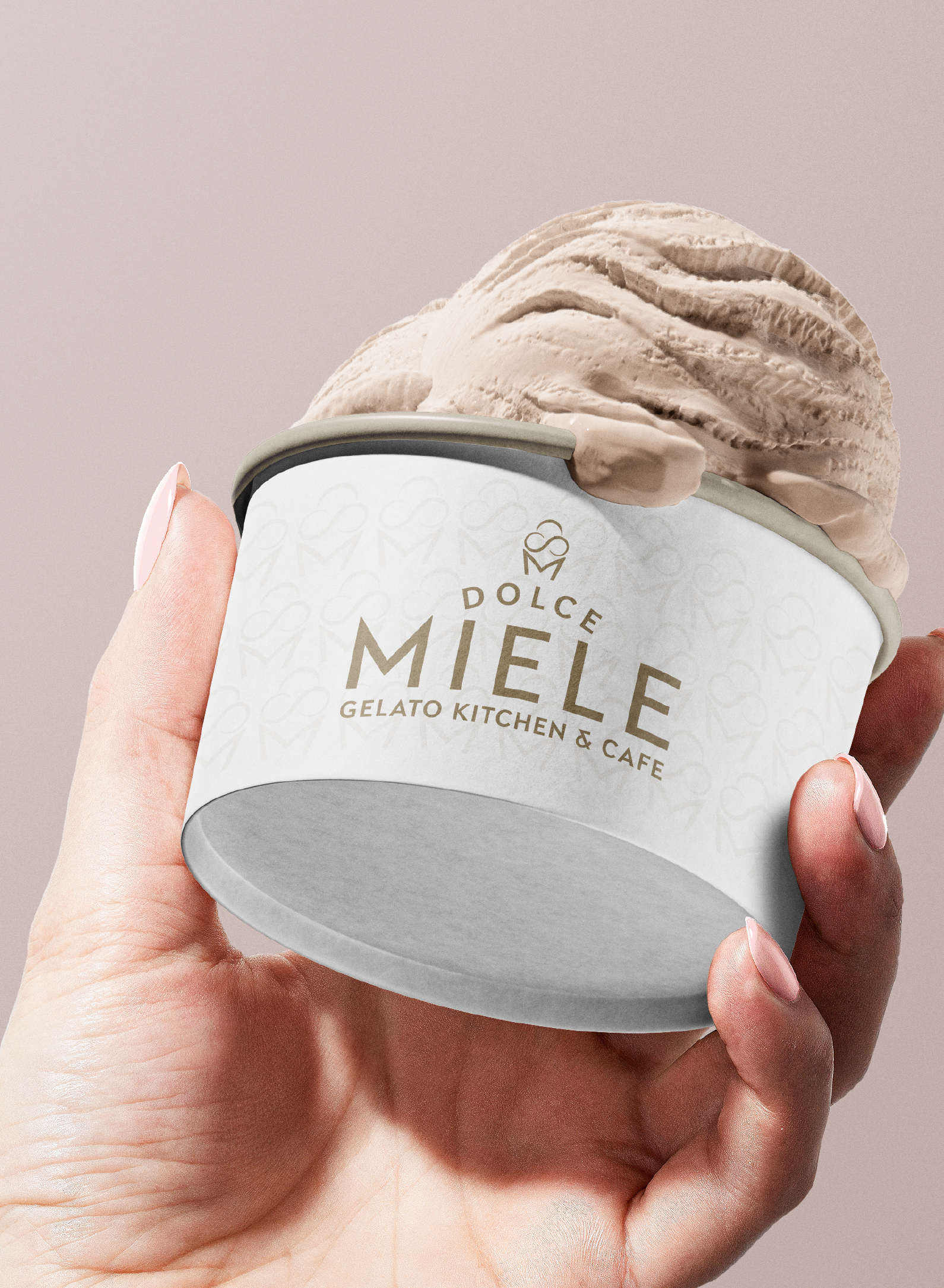 A hand holding a Dolce Miele gelato tub
